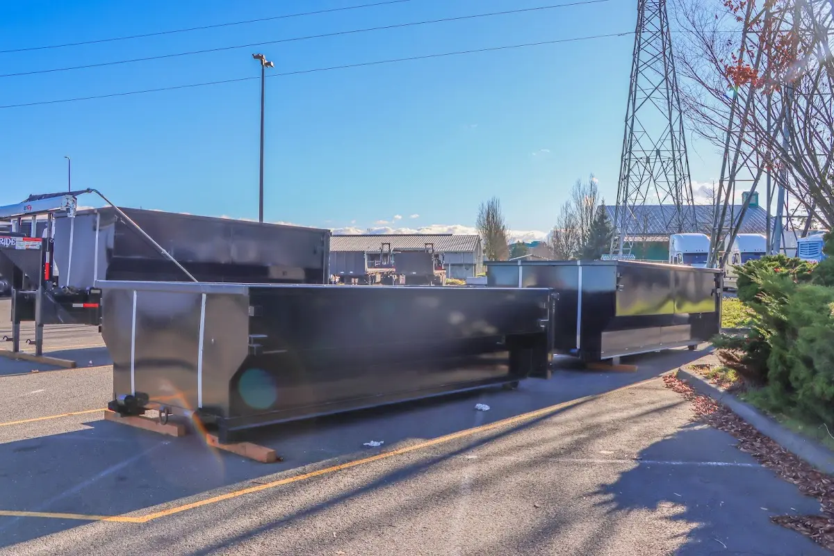 Roll-off dumpster ready for waste disposal at job site for 12 Yard Dumpster Rental in Giddings